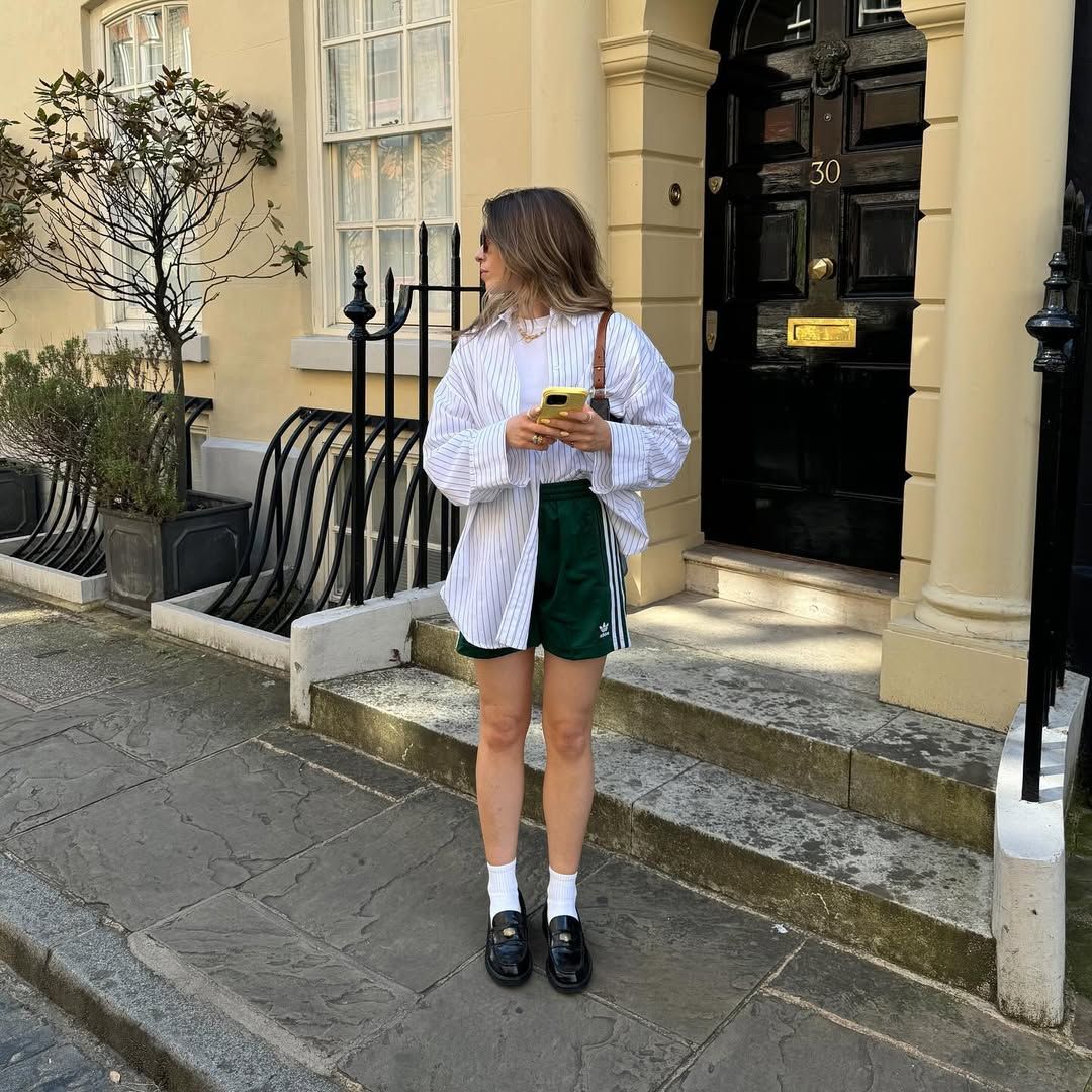 An influencer wearing adidas shorts.