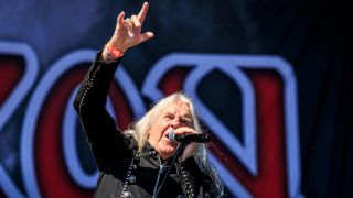Biff Byford performing onstage with Saxon in 2024