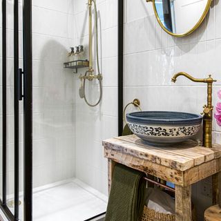 bathroom with black shower cubicle and basin