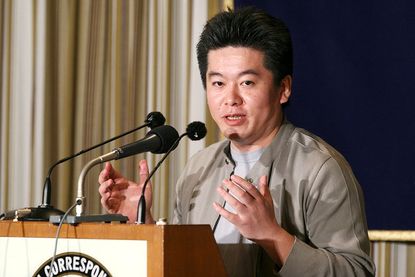 Japan'S Livedoor President Takafumi Horie, The 32-Year-Old Internet Entrepreneur, Attends A Press Conference In Tokyo, Japan On March 03, 2005.