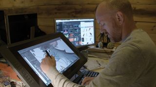 Artist working on a drawing tablet