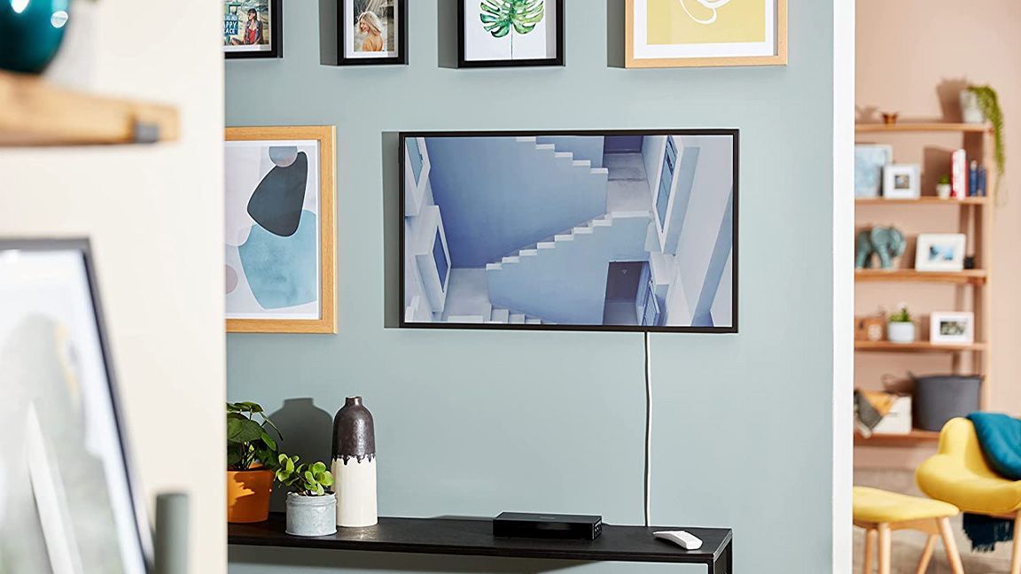 The best NFT displays are represented by a photo of Samsung&#039;s The Frame on a living room wall