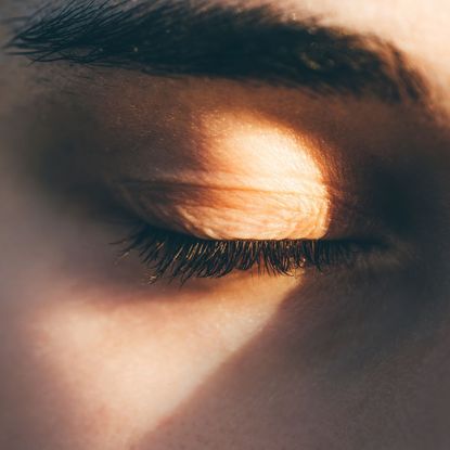 A woman's eyelashes in the sunlight