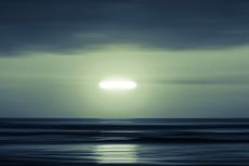 Two aircraft reported seeing a bright green UFO over Canada in July 2021.