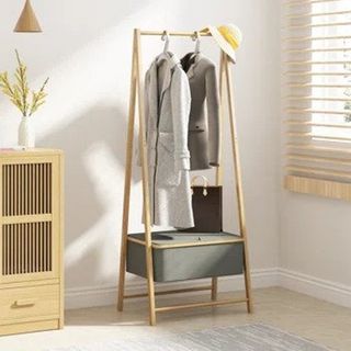 Bamboo clothes dryer with clothes hanging and storage