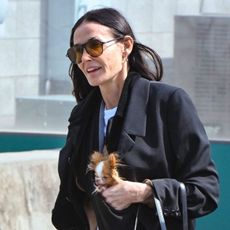 Demi Moore wearing a black blazer, jeans, and black derby shoes