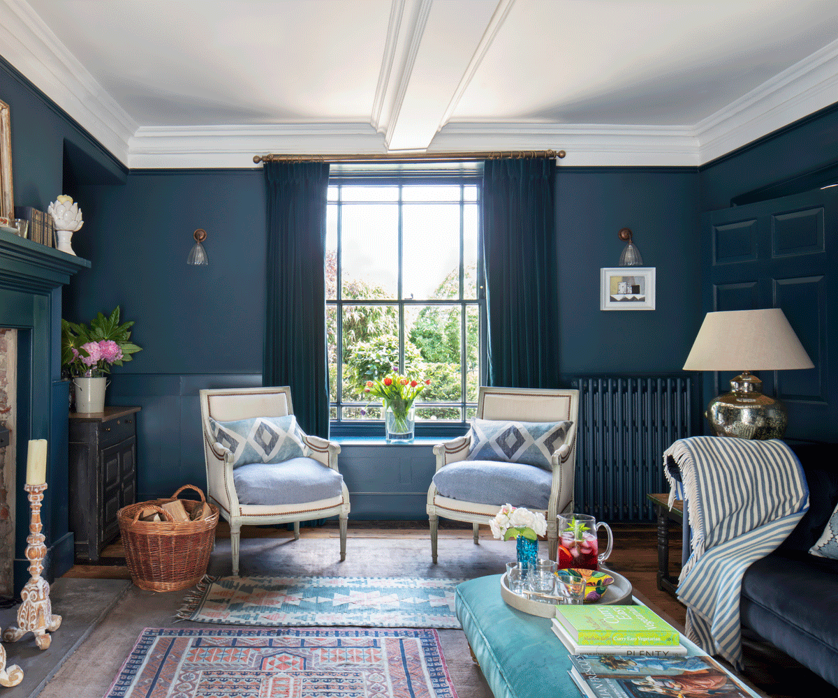 traditional sitting room with sat window and blue walls