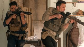 Jon Bernthal and Ben Affleck storm into a room with large guns in The Accountant 2.