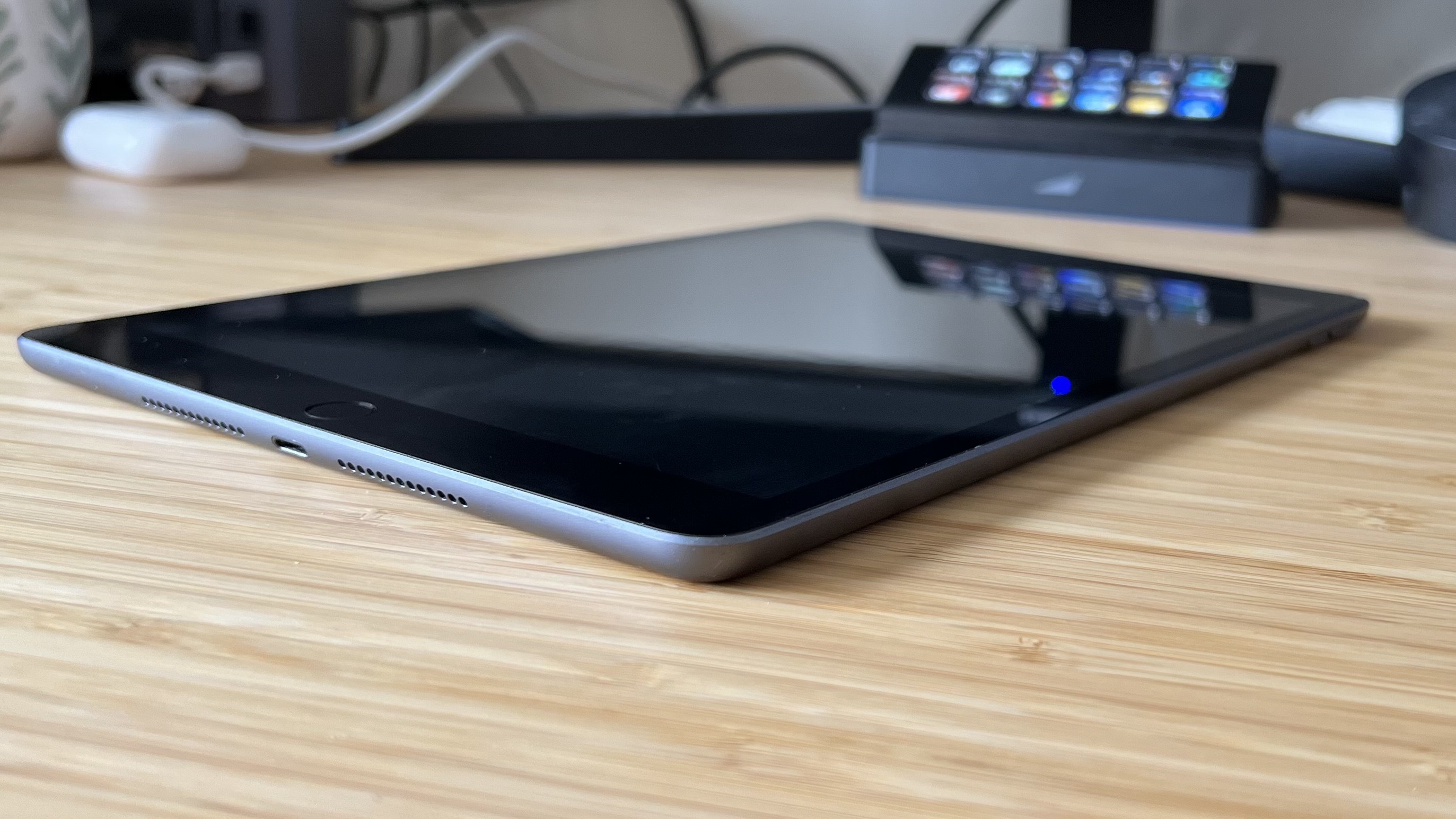 side view of iPad 9th generation on a wooden table