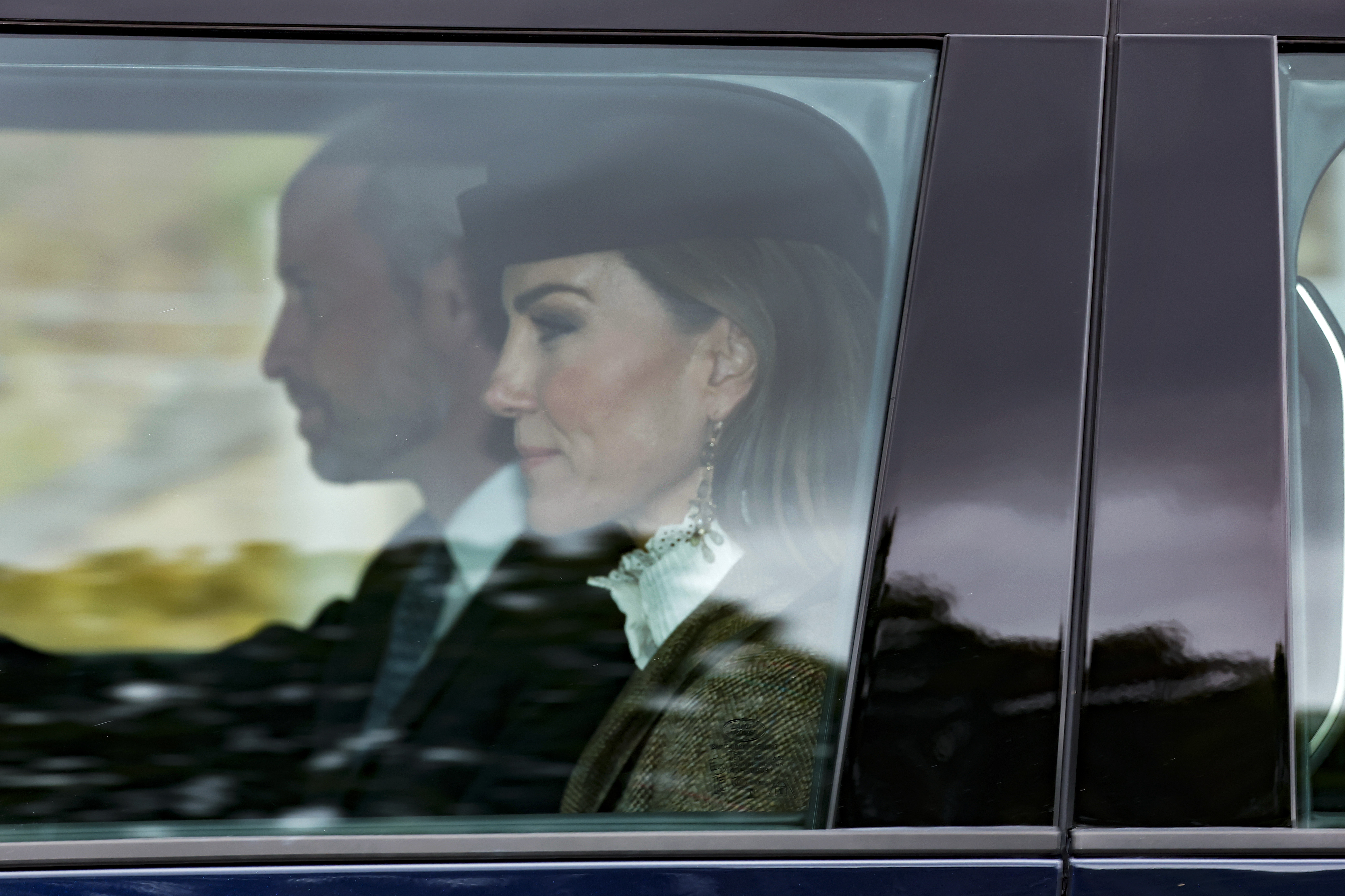 Princess Kate wears a hat with a high-neck white shirt and gray blazer to attend church in Balmoral with Prince George and Prince Louis