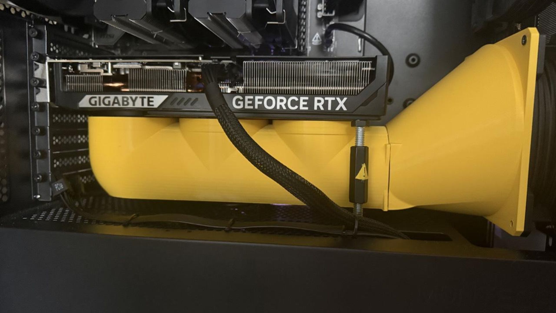 a 3d printed yellow air duct for a gaming pc, from Reddit user 'Esra-Zander'
