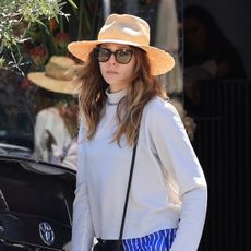 Elizabeth Olsen wearing a straw hat