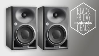 A pair of Neumann studio monitors on a grey background