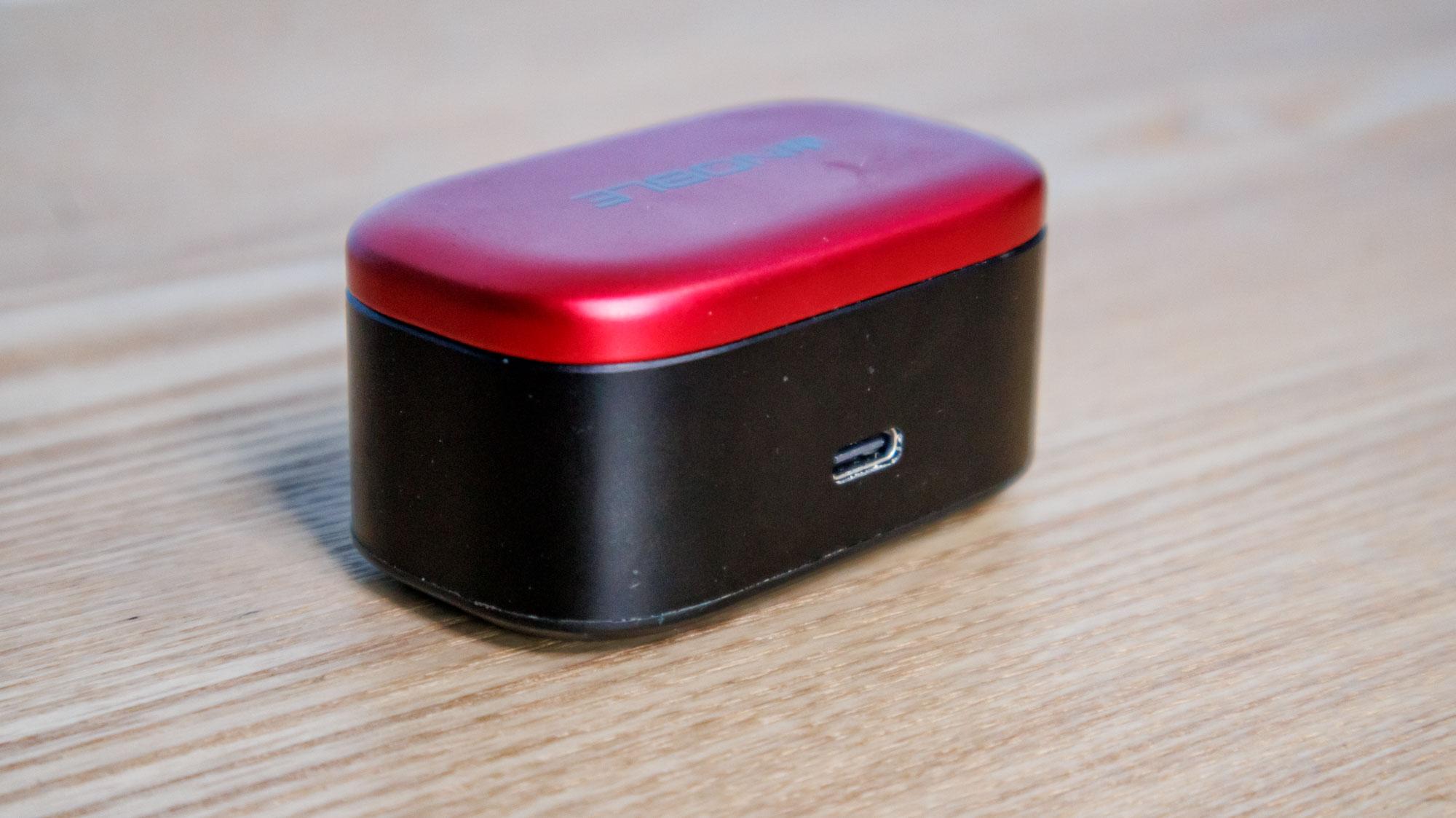 Noble Fokus Amadeus on a wooden surface, showing the rear of the case