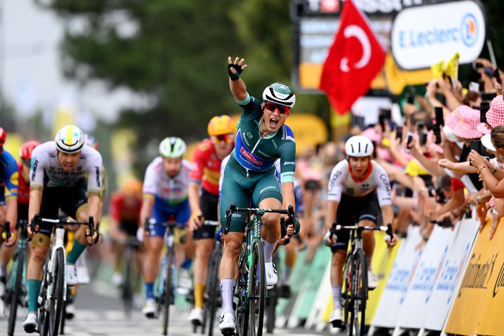 MOULINS FRANCE JULY 12 Jasper Philipsen of Belgium and Team AlpecinDeceuninck Green Points Jersey celebrates at finish line as stage winner ahead of LR Phil Bauhaus of Germany and Team Bahrain Victorious and Bryan Coquard of France and Team Cofidis during the stage eleven of the 110th Tour de France 2023 a 1798km from ClermontFerrand to Moulins UCIWT on July 12 2023 in Moulins France Photo by Tim de WaeleGetty Images