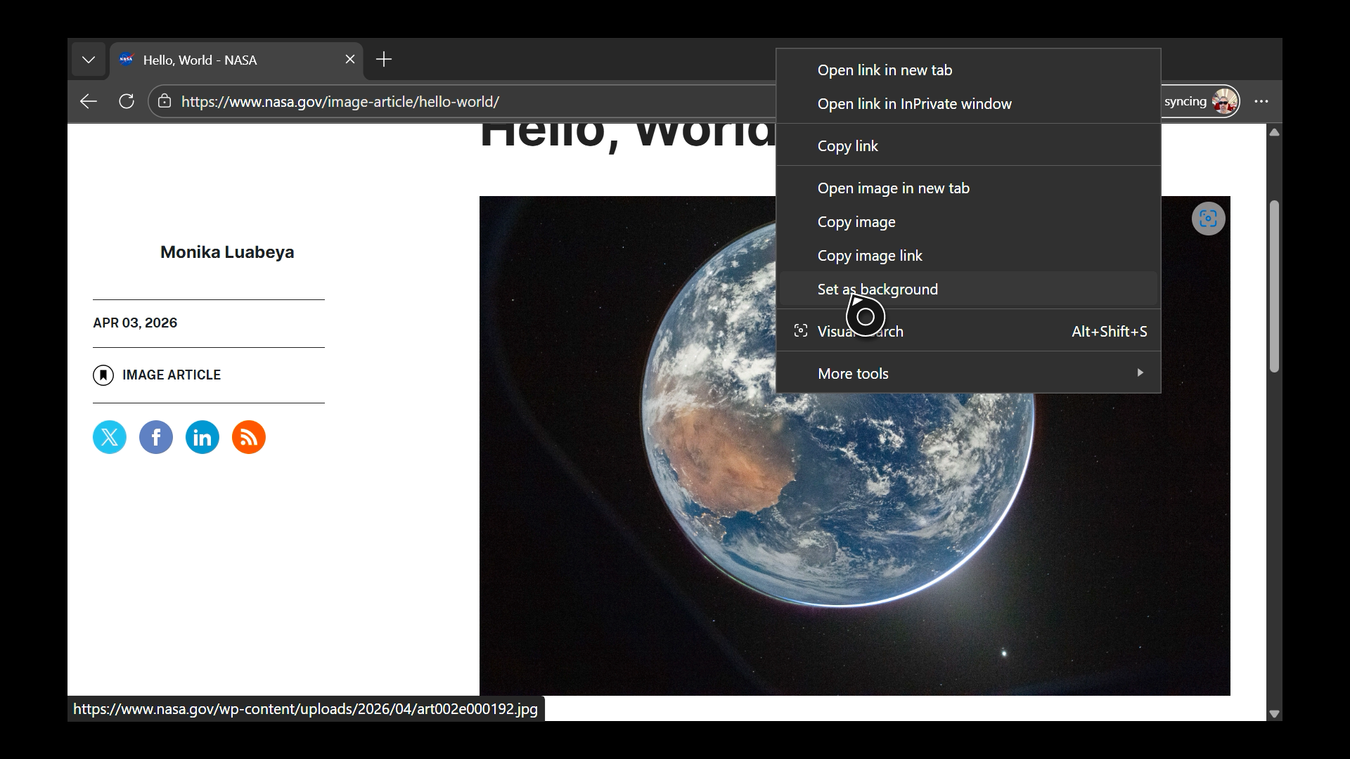 Selecting the "set as background" option for an image in Microsoft Edge on an Xbox console.