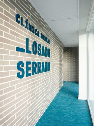 Losada Serrano written on a brick wall