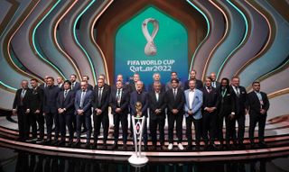 All of the World Cup managers, including England's Gareth Southgate, on stage during the FIFA World Cup draw in Qatar