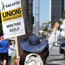 image of a striking worker sag-aftra wga strikes