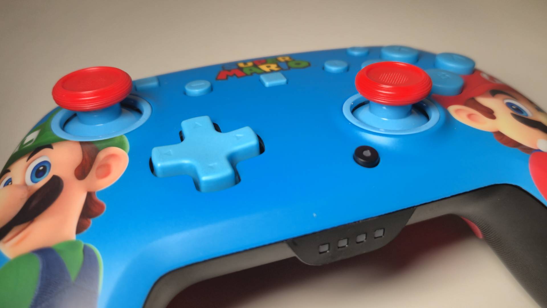 Photo of a close up of the Mario and Luigi Turtle Beach Rematch Switch 2 controller without its lighting on.