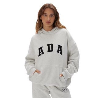 Best Pilates clothes: A woman wearing ada hoodie and sweatpants
