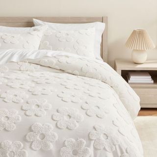 Daisy Clipped Jacquard Duvet Cover on a bed.