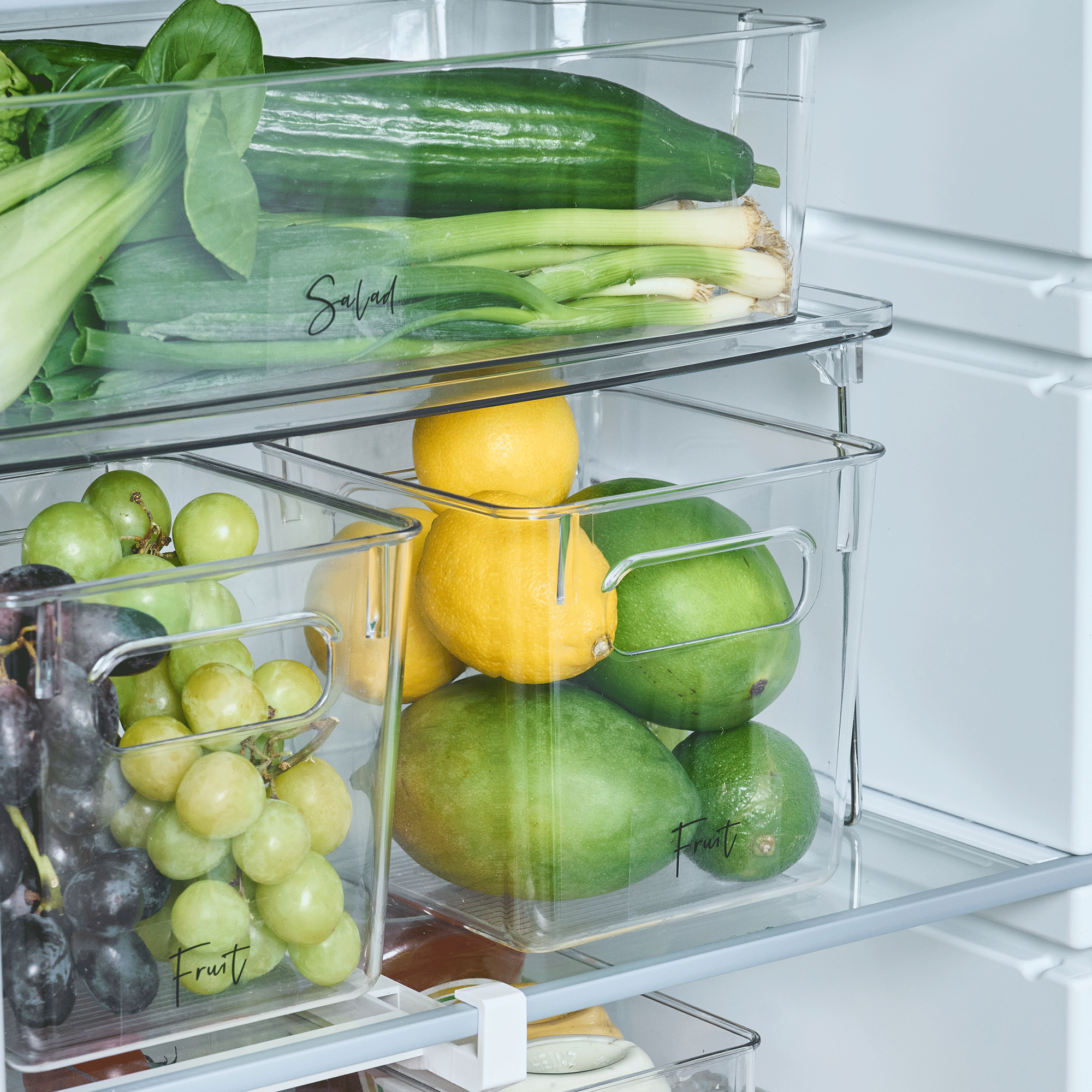 fruit in storage bins in fridge
