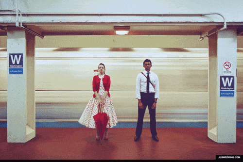 Two people standing on a train platform