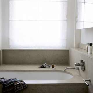 bathroom with bathtub and faucet