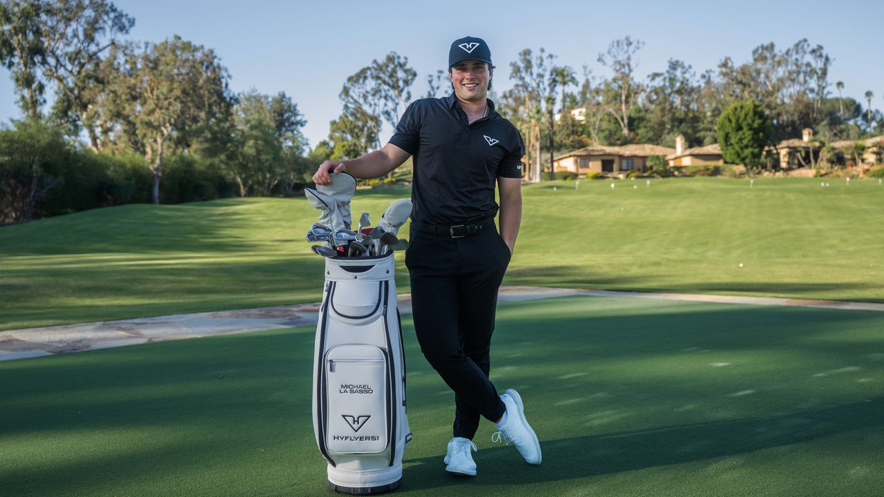 Michael La Sasso poses next to his tour bag