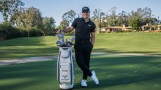 Michael La Sasso poses next to his tour bag