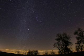 Meteors streak through the sky over Texas in this photo captured by Tony Corso during the Geminid meteor shower in December 2017.