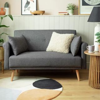 Argos Home Evie Fabric 2 Seater Sofa in a box in a living room