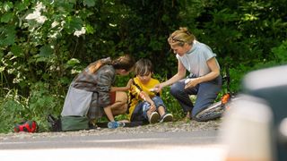 Ludmilla Makowski as Sandrine and Sally Bretton as Zoe tend to Ripley Barden as Noah who has fallen off his bike in The Au Pair.