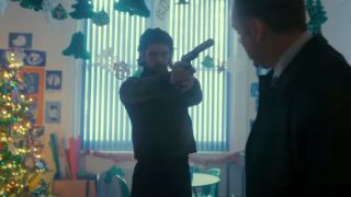 Ben Whishaw aiming a gun in Black Doves.