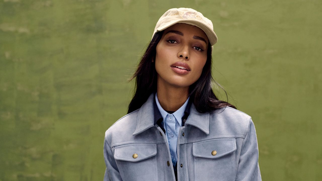 Jasmine Tookes wears a shacket and hat from Banana Republic