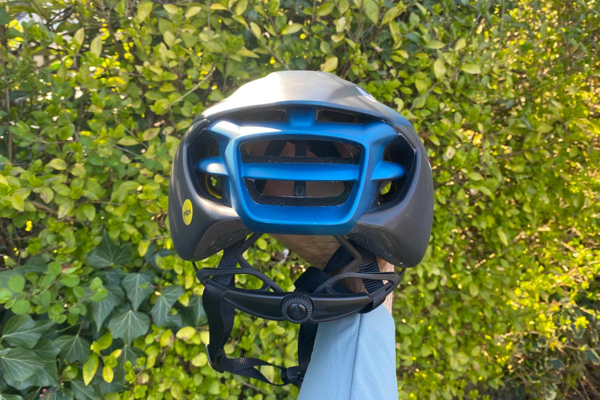 MET Manta MIPS helmet being held by a male cyclist