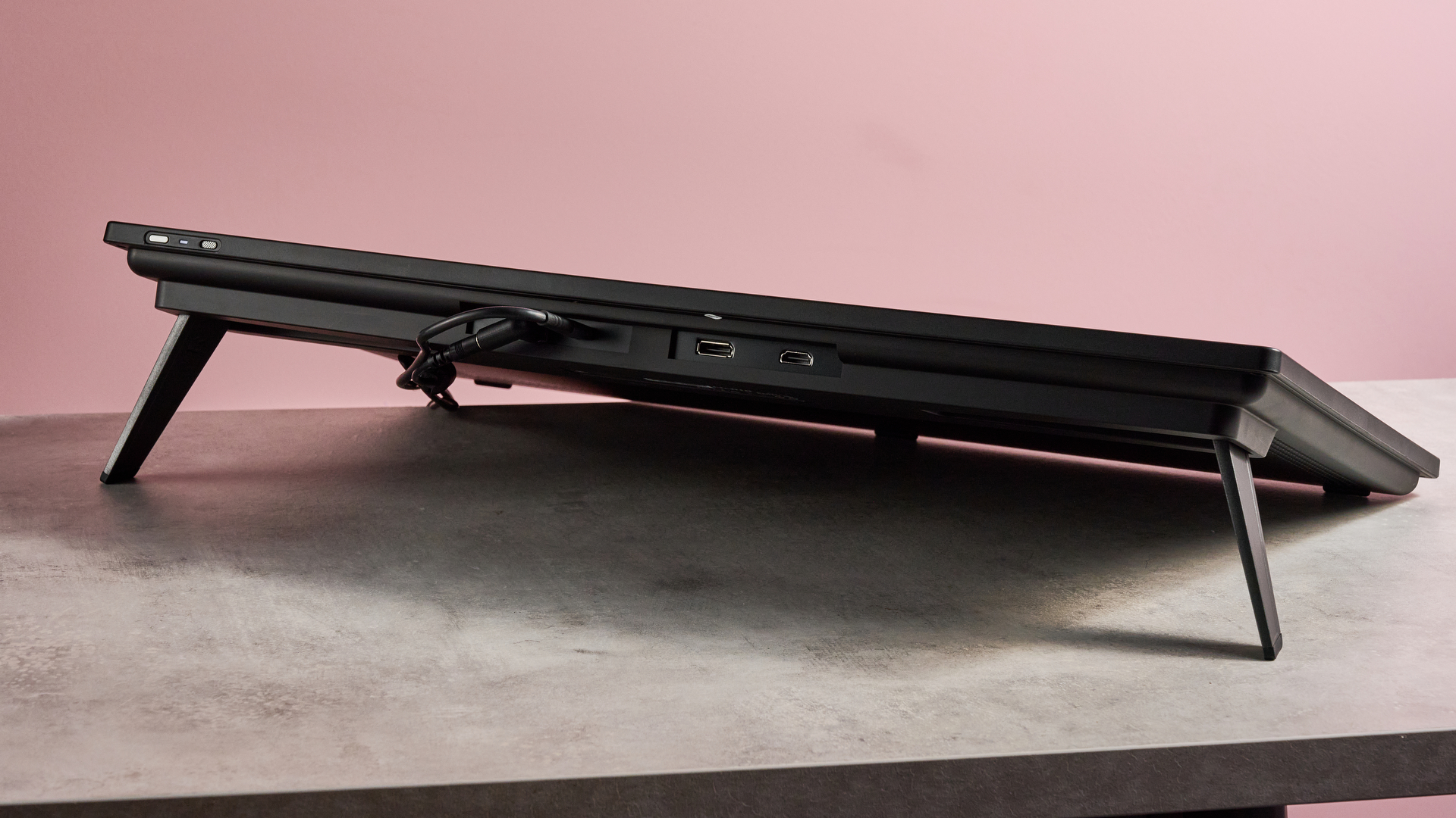 The rear of the Huion Kamvas Pro 24 Gen 3, showing its HDMI and DisplayPort, as well as its power cable and USB-C cable.