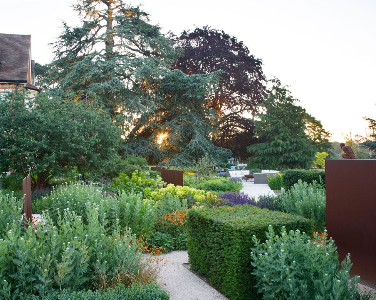 screens among planting in a summer garden