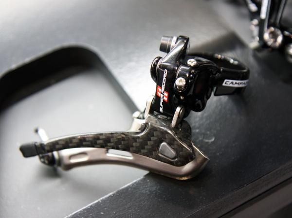 Campagnolo says a stiffer 'M-Link' on its latest front derailleur design speeds front shifts, especially under power.