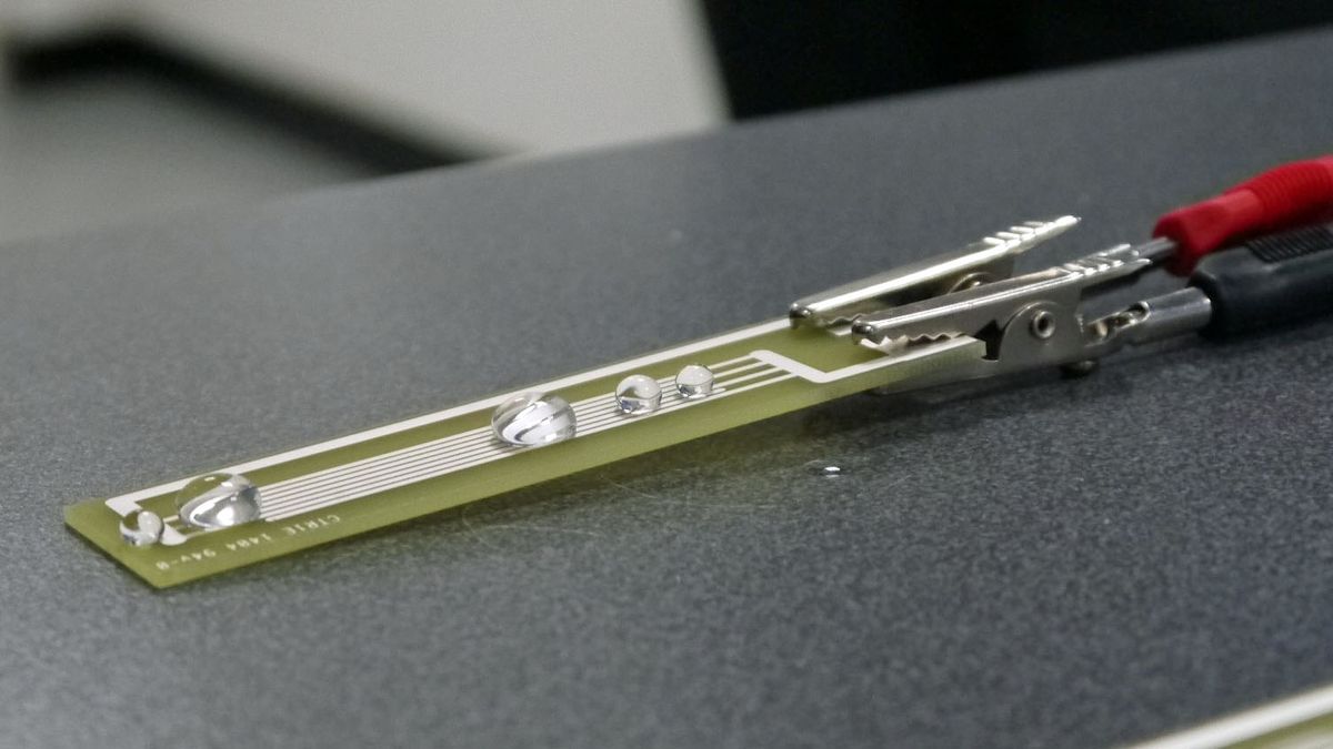 P2i's barrier coating repels water on a circuit board and droplets just roll off