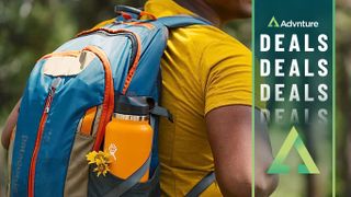 Man hiking with Hydro Flask bottle in backpack pocket