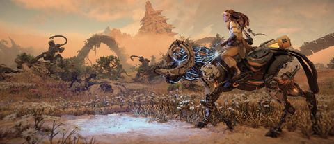 Horizon Forbidden West review; a woman rides a mechanical machine across a desert