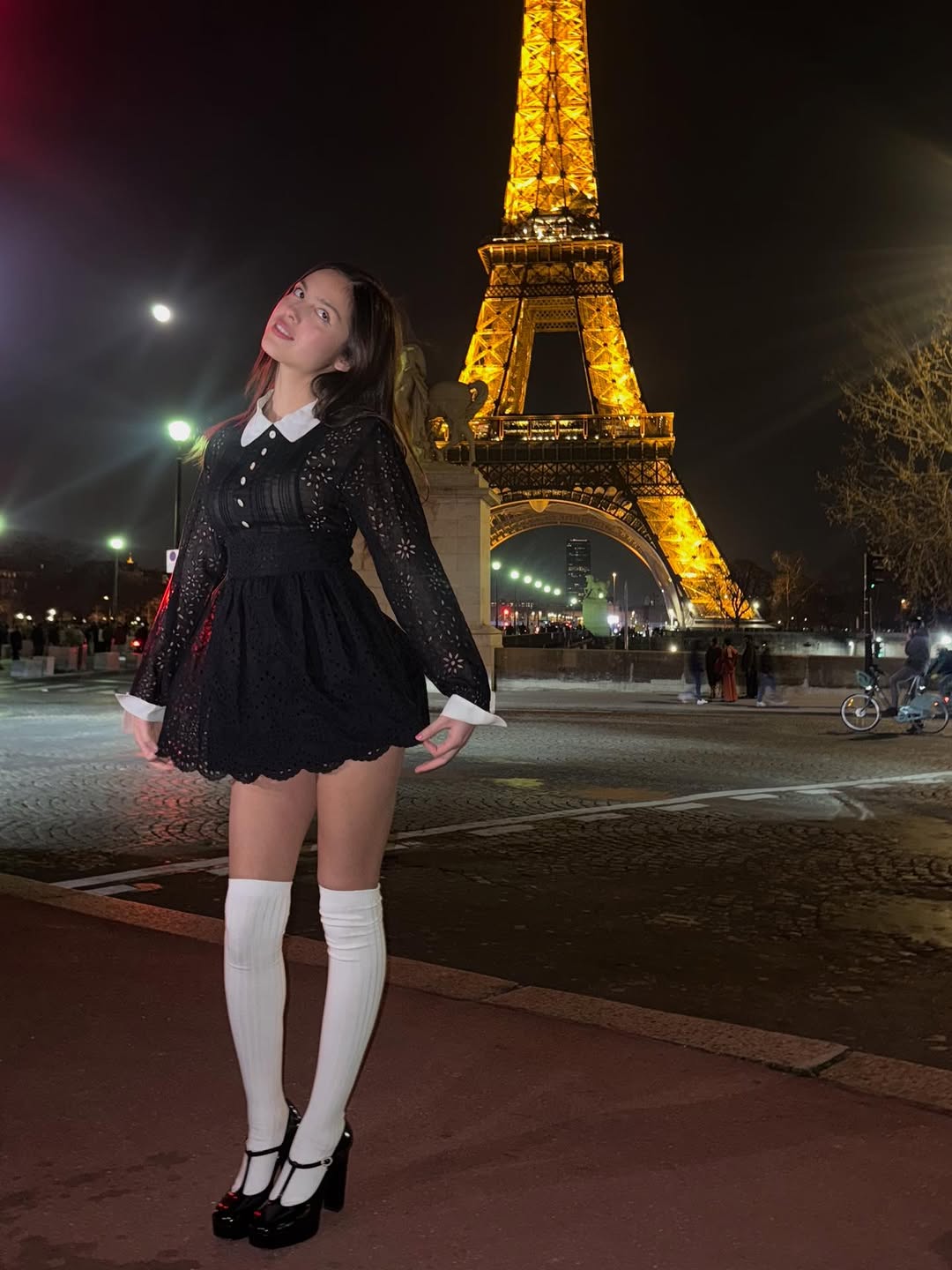 Olivia Rodrigo posed outside the Eiffel Tower in a vintage little black dress from Anna Sui Spring 1994