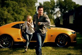 Mark Wahlberg and Nicola Peltz run for it