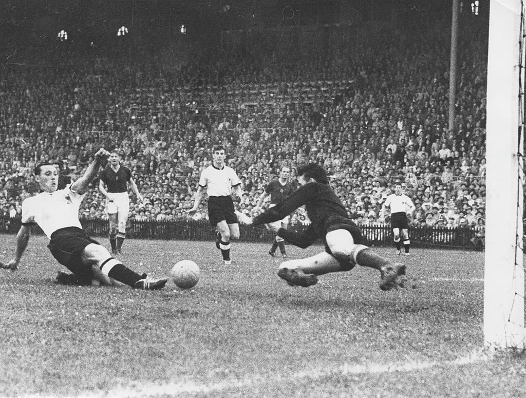 Football 1954 FIFA World Cup, Final in Berne, Switzerland: Germany vs. Hungary 3:2, scene of the match, 1:2 goal by Max Morlock (GER, l.) against Hungarian goalkeeper Gyula Grocsis, July 4, 1954 (Photo by Schirner/ullstein bild via Getty Images)