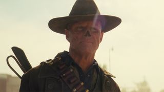 Walton Goggins as The Ghoul with a slight smile while standing outside in Fallout Season 2.
