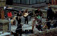 The Beatles performing their last live public concert on the rooftop of the original Apple Organization building
