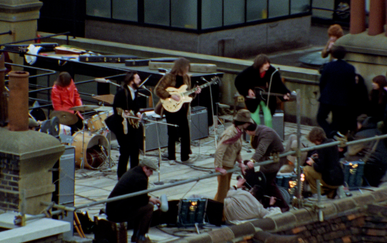 The Beatles performing their last live public concert on the rooftop of the original Apple Organization building