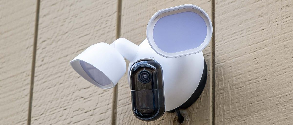 Arlo Wired Floodlight Camera attached to side of house